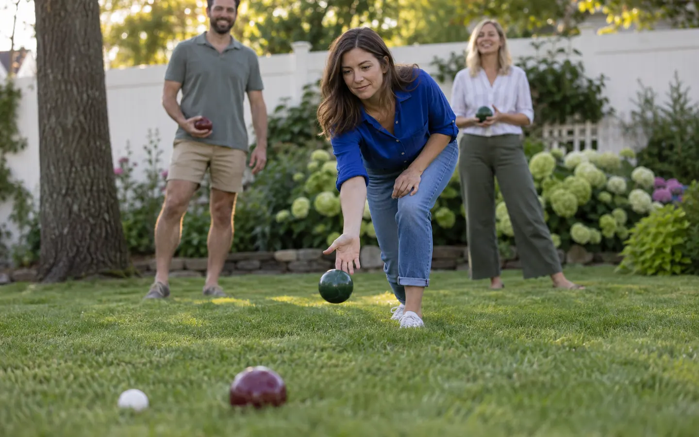 AI illustration of friends playing bocce on a backyard lawn